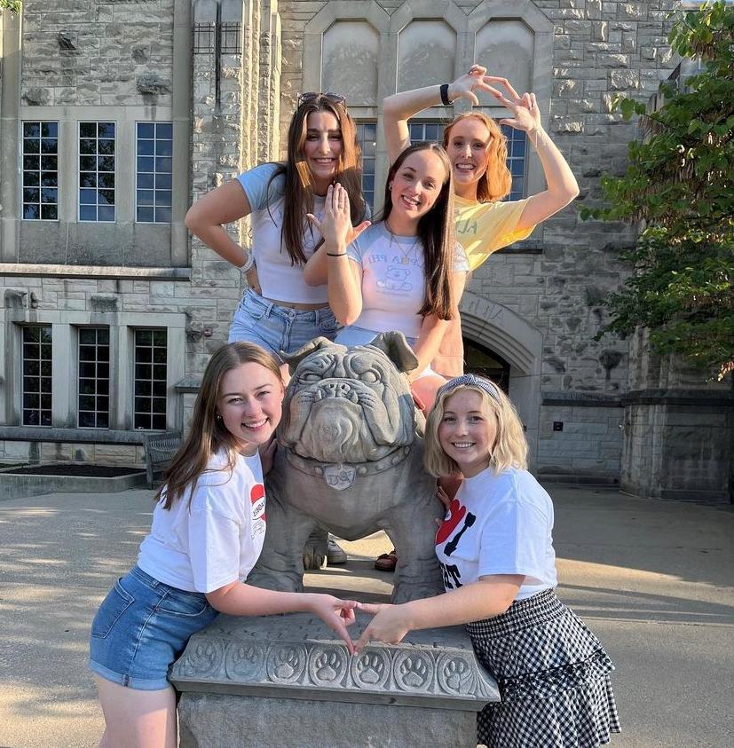 Sorority women around Butler Blue bulldog statue